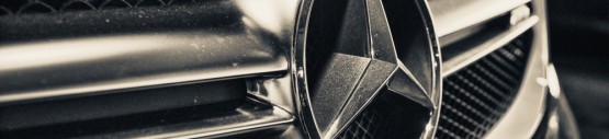 Close up of Mercedes Benz logo and grille.