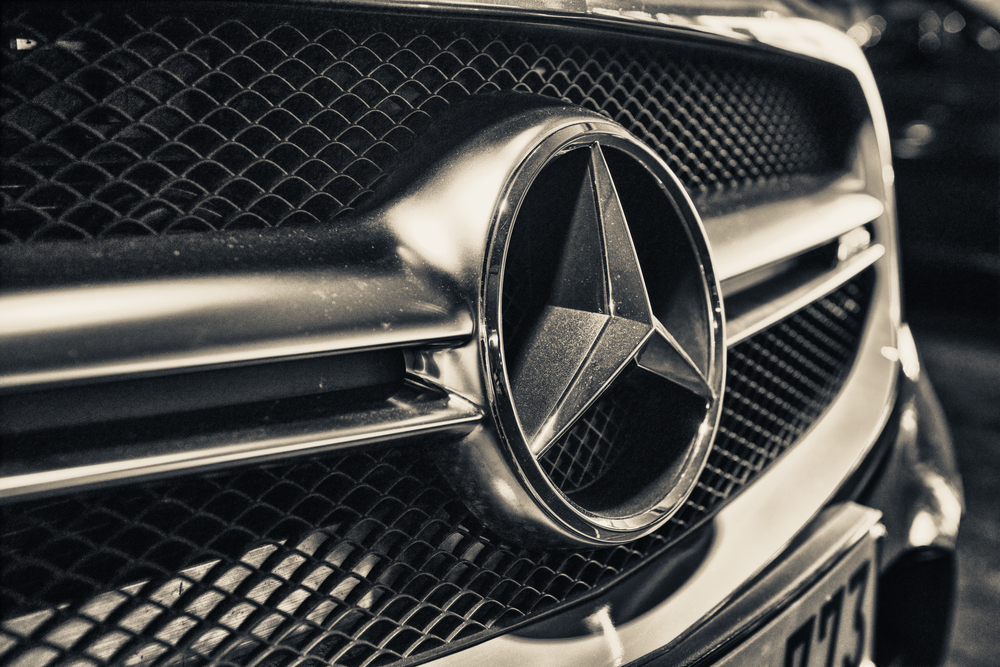 Close up of Mercedes Benz logo and grille.